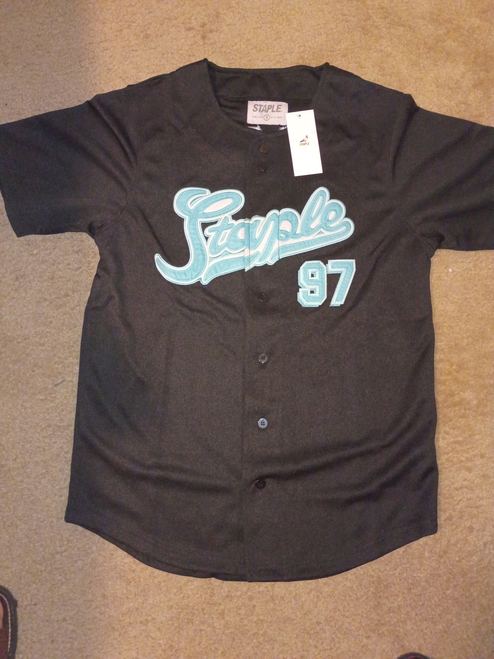 Staple Men’s Black Jersey with Teal Script and 97 Patch